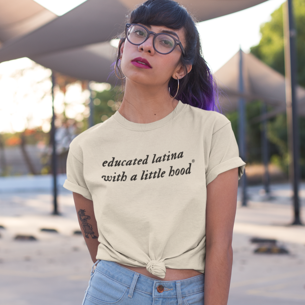 Woman wearing a cool Educated Latina with a Little Hood® shirt representing Latina resilience