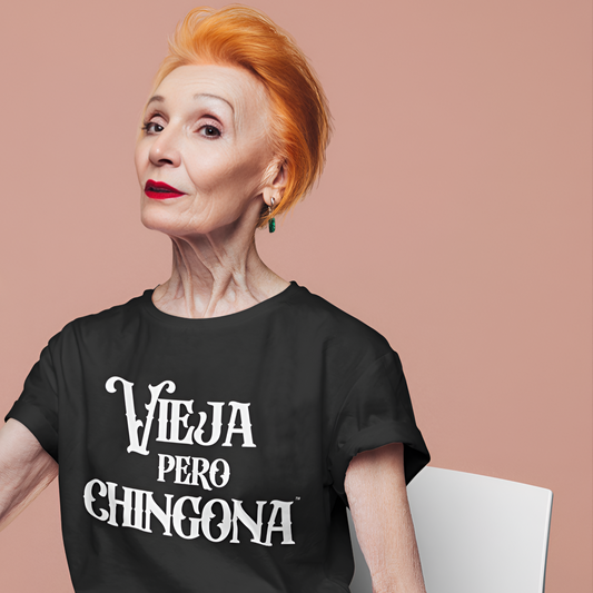 Older woman wearing a Vieja Pero Chingona Latina shirt with pride
