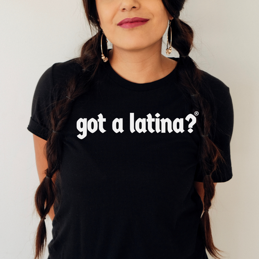 Woman wearing a Black t-shirt with bold white Got a Latina? text, Latina empowerment tee celebrating visibility and leadership