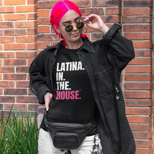 Woman wearing a political T-shirt promoting Latina representation in politics